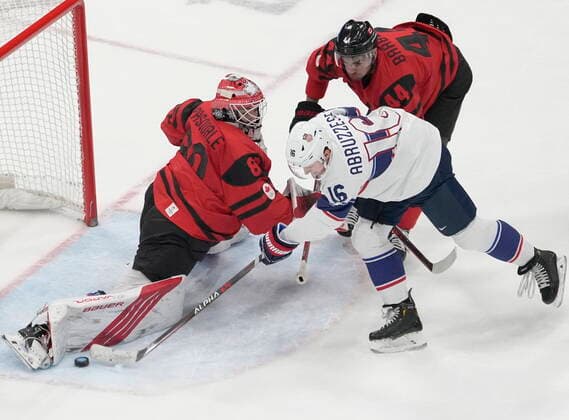 February 12, 2022, Beijing, ON, China: Team Canada goaltender Eddie Pasquale (80) makes the save on Team United States forward Nick Abruzzese (16) as Team Canada s Mark Barberio (44) moves in during first period men™s Ice hockey, Eishockey preliminary action Saturday, February 12, 2022 at the 2022 Winter Olympics in Beijing. Eddie Pasquale, Nick Abruzzese, Mark Barberio  - ZUMAc35_ 20220212_zaf_c35_038 Copyright: xRyanxRemiorzx