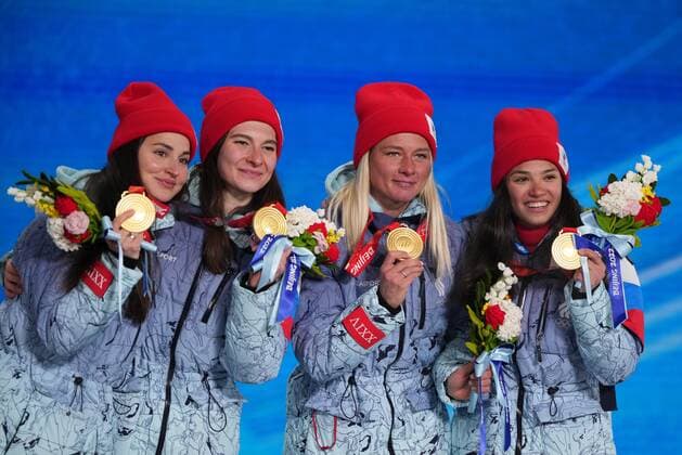 China Olympics 2022 Medal Ceremony 8112391 12.02.2022 Gold medalists Russian Olympic Committee s Yulia Stupak, Natalia Nepryaeva, Tatiana Sorina and Veronika Stepanova celebrate during the medal ceremony for the women s cross-country 4x5 km relay event during the Beijing 2022 Winter Olympic Games, Olympische Spiele, Olympia, OS at the Medals Plaza in Zhangjiakou, China. Ramil Sitdikov Sputnik Beijing China  Copyright: xRamilxSitdikovx