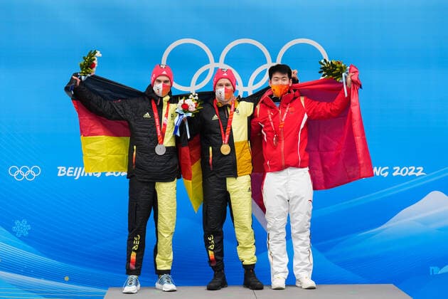 BEIJING, CHINA - FEBRUARY 11: Gold medallist Christopher Grotheer of Team Germany (C), silver medallist Axel Jungk of Team Germany (L) and bronze medallist Wengang Yan of Team China (R) pose during the Men s Skeleton medal ceremony on day seven of Beijing 2022 Winter Olympic Games, Olympische Spiele, Olympia, OS at National Sliding Centre on February 11, 2022 in Beijing, China.  Copyright: xVCGx CFP111368810978 