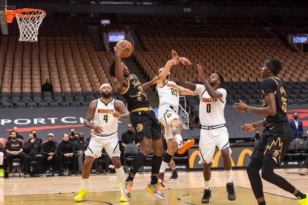 February 12, 2022, Toronto, ON, CANADA: Toronto Raptors OG Anunoby is fouled as he goes to the basket against the Denver Nuggets defence during first half NBA, Basketball Herren, USA basketball action in Toronto on Saturday, February 12, 2022. OG Anunoby  - ZUMAc35_ 20220212_zaf_c35_273 Copyright: xChrisxYoungx
