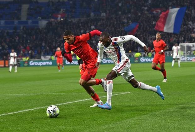 Karl Toko Ekambi (lyon) vs Flavius Daniliuc (nice) FOOTBALL: Olympique Lyonnais vs OGC Nice - Ligue 1 - 12 02 2022 FredericChambert Panoramic 
