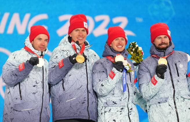 China Olympics 2022 Medal Ceremony 8113450 13.02.2022 From left, gold medalists Russian Olympic Committee s Alexey Chervotkin, Alexander Bolshunov, Denis Spitsov and Sergey Ustiugov celebrate their victory during an award ceremony for the men s cross-country 4x10 km relay event during the Beijing 2022 Winter Olympic Games, Olympische Spiele, Olympia, OS at the Medals Plaza in Zhangjiakou, China. Pavel Bednyakov Sputnik Zhangjiakou China  Copyright: xPavelxBednyakovx
