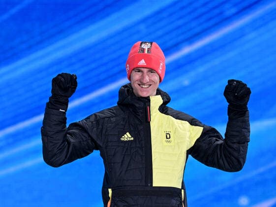 (220213) -- ZHANGJIAKOU, Feb. 13, 2022 -- Bronze medalist Karl Geiger of Germany reacts during the awarding ceremony of Ski jumping, Skispringen, Ski, nordisch men s large hill individual at Zhangjiakou Medals Plaza of the Winter Olympics in Zhangjiakou, north China s Hebei Province, Feb. 13, 2022. ) (BEIJING2022)CHINA- ZHANGJIAKOU-OLYMPIC Winter games, Winterspiele,Spiele, Summer games AWARDING CEREMONY (CN) FengxKaihua