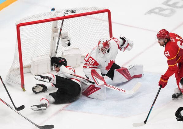 (220213) -- BEIJING, Feb. 13, 2022 -- Corban Knight (L) of Canada falls during the Ice hockey, Eishockey men s preliminary round Group A match between China and Canada at National Indoor Stadium in Beijing, capital of China, Feb. 13, 2022. ) (BEIJING2022)CHINA-BEIJING-OLYMPIC Winter games, Winterspiele,Spiele, Summer games ICE HOCKEY-MEN S PRELIMINARY-CHN VS CAN(CN) DuxYu 
