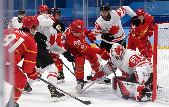 (220213) -- BEIJING, Feb. 13, 2022 -- Luo Jia (C) of China tries to shoot during the Ice hockey, Eishockey men s preliminary round Group A match between China and Canada at National Indoor Stadium in Beijing, capital of China, Feb. 13, 2022. ) (BEIJING2022)CHINA-BEIJING-OLYMPIC Winter games, Winterspiele,Spiele, Summer games ICE HOCKEY-MEN S PRELIMINARY-CHN VS CAN(CN) LiuxXiao 