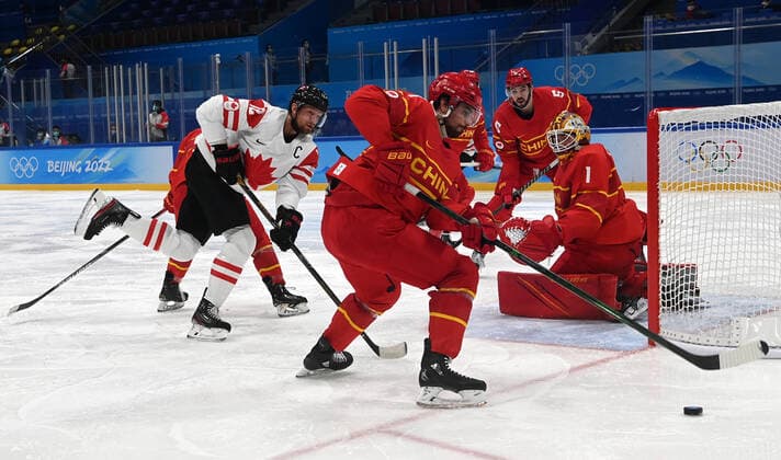 (220214) -- BEIJING, Feb. 13, 2022 -- Goalkeeper Yongli Ouban (1st L) makes a save during the Ice hockey, Eishockey men s preliminary round Group A match between China and Canada at National Indoor Stadium in Beijing, capital of China, Feb. 13, 2022. ) (BEIJING2022)CHINA-BEIJING-OLYMPIC Winter games, Winterspiele,Spiele, Summer games ICE HOCKEY-MEN S PRELIMINARY-CHN VS CAN(CN) LiuxXiao 