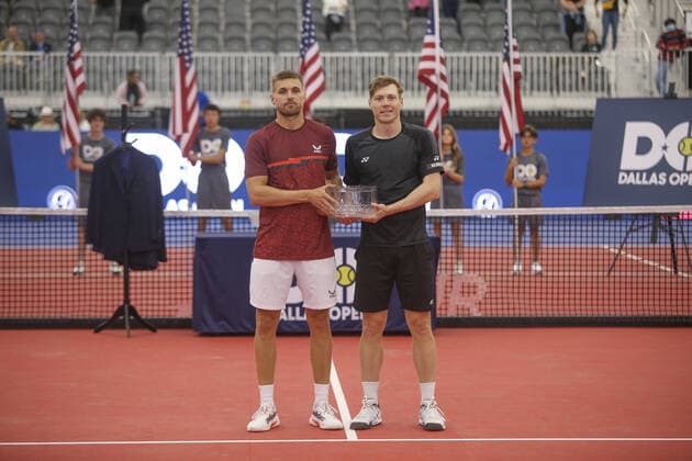 DALLAS, TX - FEBRUARY 13: Lloyd Glasspool (GBR) and Harri Heliovaara (FIN) pose with the runner-up trophy after the Dallas Open on February 13, 2022 at the Styslinger Altec Tennis Complex in Dallas, TX. (Photo by George Walker Icon Sportswire) TENNIS: FEB 13 Dallas Open Icon22021331