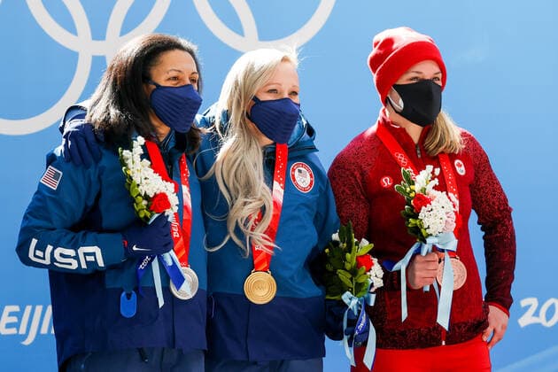 BEIJING, CHINA â€“ FEBRUARY 14, 2022: Silver medallist Elana Meyers Taylor of the United States, gold medallist Kaillie Humphries of the United States, and bronze medallist Christine de Bruin (L-R) of Canada pose at a victory ceremony for the women s monobob event during the Beijing 2022 Winter Olympic Games, Olympische Spiele, Olympia, OS at the Yanqing National Sliding Centre. Anton Novoderezhkin TASS  TS123035