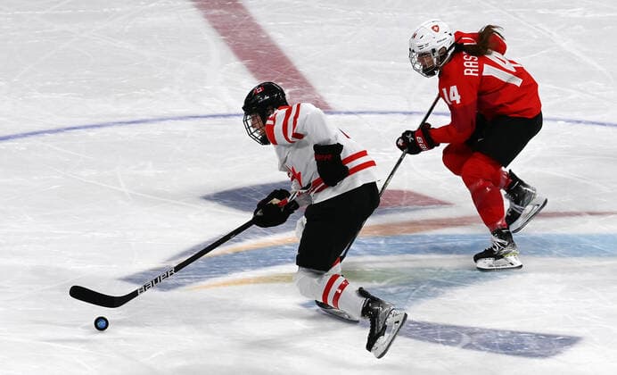 (220214) -- BEIJING, Feb. 14, 2022 -- Evelina Raselli (R) of Switzerland competes during the Ice hockey, Eishockey women s play-off semifinal between Canada and Switzerland at Wukesong Sports Centre in Beijing, capital of China, Feb. 14, 2022. ) (BEIJING2022)CHINA-BEIJING-OLYMPIC Winter games, Winterspiele,Spiele, Summer games ICE HOCKEY-WOMEN S PLAYOFF SEMIFINAL-CANADA VS SWITZERLAND (CN) LiuxXiao 