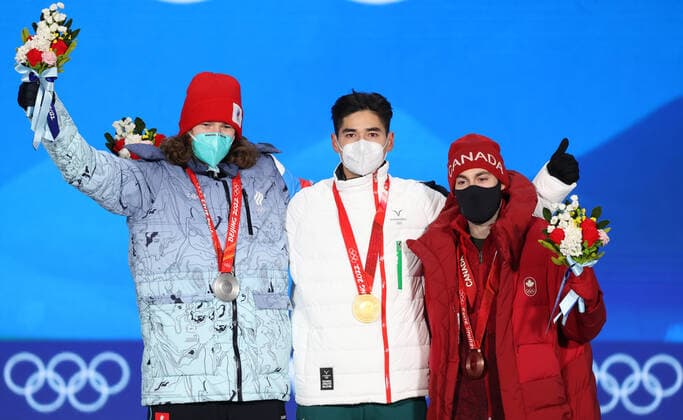 BEIJING, CHINA - FEBRUARY 14, 2022: Silver medalist, ROC athlete Konstantin Ivliyev, Gold medalist, Shaoang Liu of Hungary and Bronze medalist, Steven Dubois (L-R) of Canada attend an award ceremony for the men s 500m short track Speed skating, Eisschnelllauf event at the 2022 Winter Olympic Games, Olympische Spiele, Olympia, OS at the Medal Plaza. Anton Novoderezhkin TASS TS12316C
