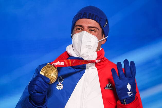 ZHANGJIAKOU, CHINA - FEBRUARY 14, 2022: Gold medalist, Quentin Fillon Maillet of France attends an award ceremony for the men s 12.5km biathlon pursuit event at the 2022 Winter Olympic Games, Olympische Spiele, Olympia, OS at the Medal Plaza. Sergei Bobylev TASS  TS123172