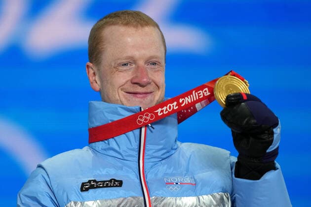 (220214) -- ZHANGJIAKOU, Feb. 14, 2022 -- Gold medalist Johannes Thingnes Boe of Norway reacts during the awarding ceremony of biathlon men s 10km sprint at Zhangjiakou Medals Plaza of the Winter Olympics in Zhangjiakou, north China s Hebei Province, Feb. 14, 2022. ) (BEIJING2022)CHINA- ZHANGJIAKOU-OLYMPIC Winter games, Winterspiele,Spiele, Summer games AWARDING CEREMONY (CN) ZhanxYan 