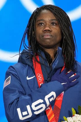 Erin Jackson of the U.S. cries as she listens to her national anthem during the medals ceremony for the Women s Speed skating, Eisschnelllauf 500 meter race at the Beijing 2022 Winter Olympics on Monday, February 14, 2022. Jackson won the gold medal.  OLY20220214302 PaulxHanna