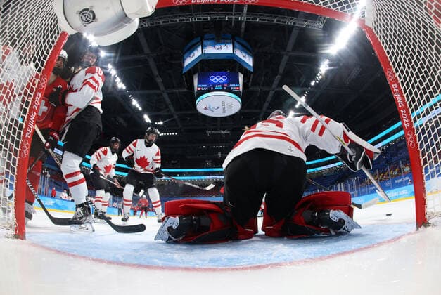 (220214) -- BEIJING, Feb. 14, 2022 -- Goalkeper Ann-Renee Desbiens (1st R) of Canada tries to make a save during during the Ice hockey, Eishockey women s semifinal between Canada and Switzerland at Wukesong Sports Centre in Beijing, capital of China, Feb. 14, 2022. ) (BEIJING2022)CHINA-BEIJING-OLYMPIC Winter games, Winterspiele,Spiele, Summer games ICE HOCKEY-WOMEN S PLAYOFF SEMIFINAL-CAN VS SUI(CN) SongxYanhua 