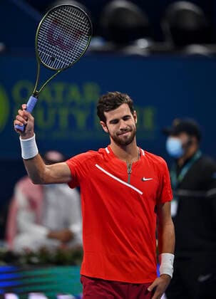 (220215) -- DOHA, Feb. 15, 2022 -- Karen Khachanov of Russia reacts after winning the first round of ATP, Tennis Herren Qatar Open tennis match against Mackenzie McDonald of the United States in Doha, capital of Qatar, Feb. 14, 2022. (Photo by Xinhua) (SP)QATAR-DOHA-TENNIS-ATP QATAR OPEN Nikku 