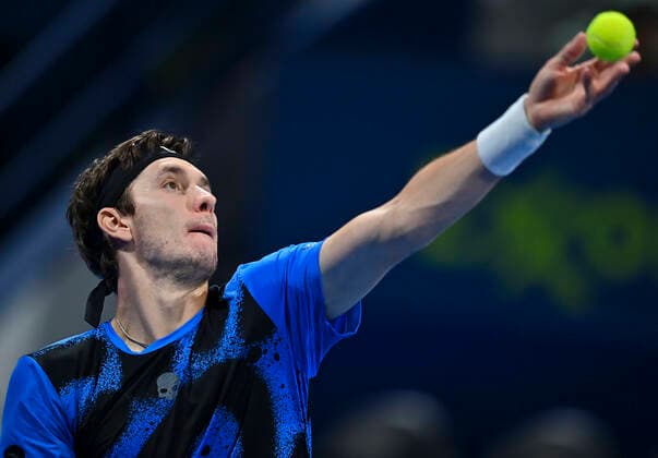 (220215) -- DOHA, Feb. 15, 2022 -- Egor Gerasimov of Belarus serves to Dan Evans of Great Britain during the first round of ATP, Tennis Herren Qatar Open tennis match in Doha, capital of Qatar, Feb. 14, 2022. (Photo by Xinhua) (SP)QATAR-DOHA-TENNIS-ATP QATAR OPEN Nikku 