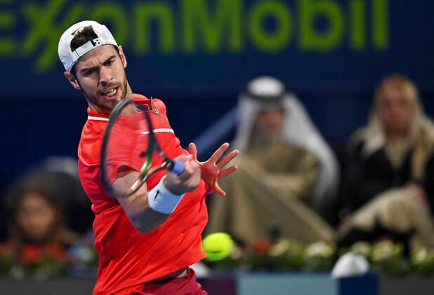 (220215) -- DOHA, Feb. 15, 2022 -- Karen Khachanov of Russia hits a return during the first round of ATP, Tennis Herren Qatar Open tennis match against Mackenzie McDonald of the United States in Doha, capital of Qatar, Feb. 14, 2022. (Photo by Xinhua) (SP)QATAR-DOHA-TENNIS-ATP QATAR OPEN Nikku 