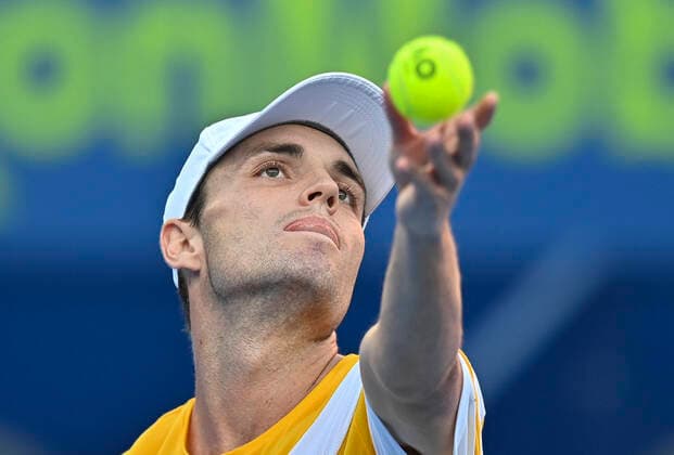 (220215) -- DOHA, Feb. 15, 2022 -- Christopher O Connell of Australia serves to Alex Molcan of Slovakia during the first round of ATP, Tennis Herren Qatar Open tennis match in Doha, capital of Qatar, Feb. 14, 2022. (Photo by Xinhua) (SP)QATAR-DOHA-TENNIS-ATP QATAR OPEN Nikku 