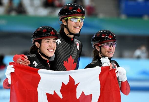 China Olympics 2022 Speed skating, Eisschnelllauf Women Team Pursuit 8115282 15.02.2022 Canada s Valerie Maltais, Isabelle Weidemann and Ivanie Blondin hold their national flag after winning the women s speed skating team pursuit final during the Beijing 2022 Winter Olympic Games, Olympische Spiele, Olympia, OS at the National Speed Skating Oval in Beijing, China. Vladimir Astapkovich Sputnik Beijing China  Copyright: xVladimirxAstapkovichx