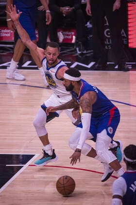February 14, 2022, Los Angeles, California, USA: Marcus Morris 8 of the Los Angeles Clippers runs with the ball as Stephen Curry 30 of the Golden State Warriors attempts to steal the ball during their NBA, Basketball Herren, USA game on Monday February 14, 2022 at Crypto.com Arena in Los Angeles, California. Clippers defeat Warriors, 119-104. ARIANA RUIZ PI Los Angeles USA - ZUMAp124 20220214_zaa_p124_012 Copyright: xArianaxRuizx