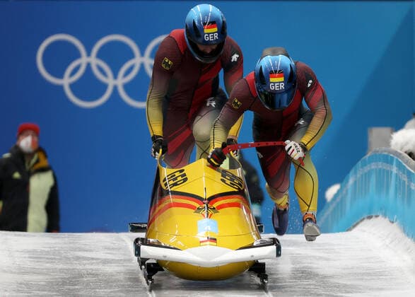 BEIJING, CHINA - FEBRUARY 15, 2022: Athletes Francesco Friedrich and Thorsten Margis of Germany compete in the two-man bobsleigh event at the Yanqing National Sliding Centre as part of the 2022 Winter Olympic Games, Olympische Spiele, Olympia, OS Anton Novoderezhkin TASS  TS123492