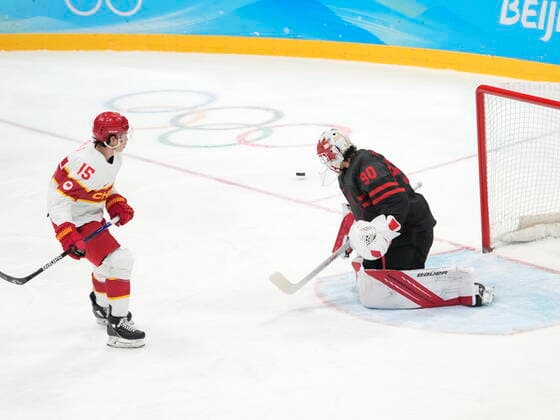 February 15, 2022, Beijing, China: Team Canada goalkeeper Matt Tomkins (90) stops Team China s Jiang Fu (15) on a penalty shot during first period men s qualification round hockey action at the Beijing Winter Olympics in Beijing, China, on Tuesday, Feb. 15, 2022. Canada News - February 15, 2022  - ZUMAc35_ 20220215_zaf_c35_109 Copyright: xRyanxRemiorzx