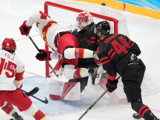 February 15, 2022, Beijing, China: Team China forward Taile Wang (91) crashes into Team Canada goaltender Matt Tomkins (90) as Canada defender Mark Barberio (44) looks on during first period men s qualification round hockey action at the Beijing Winter Olympics in Beijing, China, on Tuesday, Feb. 15, 2022. Canada News - February 15, 2022  - ZUMAc35_ 20220215_zaf_c35_113 Copyright: xRyanxRemiorzx
