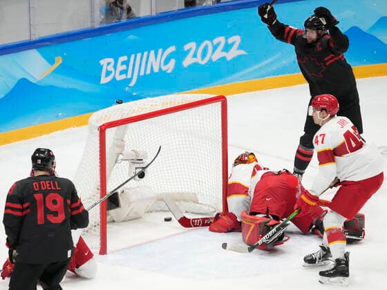 February 15, 2022, Beijing, China: Team Canada forwards Eric Staal (12) and Eric O Dell (19) celebrate a goal by teammate Jordan Weal (not shown) past Team China goaltender Jeremy Smith as China s An Jian (47) skates by during first period men s qualification round hockey action at the Beijing Winter Olympics in Beijing, China, on Tuesday, Feb. 15, 2022. Canada News - February 15, 2022  - ZUMAc35_ 20220215_zaf_c35_114 Copyright: xRyanxRemiorzx