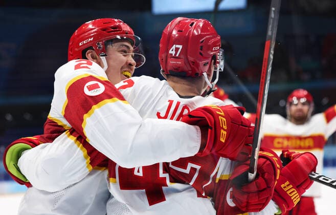 (220215) -- BEIJING, Feb. 15, 2022 -- Liu Jie (L) and Jian An of China celebrate scoring during the Ice hockey, Eishockey men s qualification play-off of Beijing 2022 Winter Olympics between Canada and China at Wukesong Sports Centre, in Beijing, capital of China, Feb. 15, 2022. ) (BEIJING2022)CHINA-BEIJING-OLYMPIC Winter games, Winterspiele,Spiele, Summer games ICE HOCKEY-MEN S QUALIFICATION PLAY-OFF-CAN VS CHN (CN) MengxYongmin