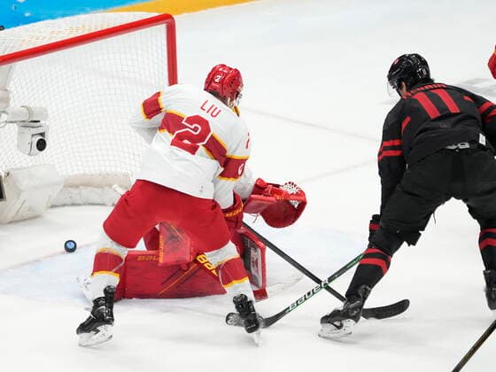 February 15, 2022, Beijing, China: Team Canada forward Jack McBain scores past Team China goaltender Paris O Brien (1) China defenceman Jie Liu (2) looks on during third period men s qualification round hockey action at the Beijing Winter Olympics in Beijing, China, on Tuesday, Feb. 15, 2022. Canada News - February 15, 2022  - ZUMAc35_ 20220215_zaf_c35_127 Copyright: xRyanxRemiorzx