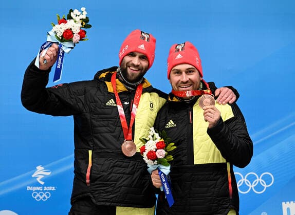 (220215) -- BEIJING, Feb. 15, 2022 -- Bronze medalists Christoph Hafer Matthias Sommer of Germany celebrate after the bobsleigh 2-man heat of Beijing 2022 Winter Olympics at National Sliding Centre in Yanqing District, Beijing, capital of China, Feb. 15, 2022. ) (BEIJING2022)CHINA-BEIJING-OLYMPIC Winter games, Winterspiele,Spiele, Summer games BOBSLEIGH-2-MEN-HEAT(CN) HexChangshan 