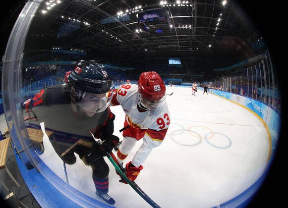 (220215) -- BEIJING, Feb. 15, 2022 -- Yuan Junjie (2nd L) of China vies with Jordan Weal of Canada during the Ice hockey, Eishockey men s qualification play-off of Beijing 2022 Winter Olympics between Canada and China at Wukesong Sports Centre, in Beijing, capital of China, Feb. 15, 2022. ) (BEIJING2022)CHINA-BEIJING-OLYMPIC Winter games, Winterspiele,Spiele, Summer games ICE HOCKEY-MEN S QUALIFICATION PLAY-OFF-CAN VS CHN (CN) MengxYongmin