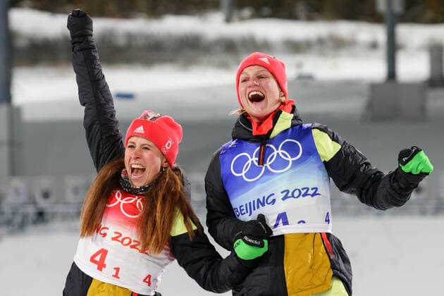 ZHANGJIAKOU, CHINA - FEBRUARY 16, 2022: Gold medalists Katharina Hennig (L) and Victoria Carl of Germany at a flower ceremony after the women s cross-country skiing team sprint classic final at the 2022 Winter Olympic Games, Olympische Spiele, Olympia, OS at the National Cross-Country Skiing Centre. Stanislav Krasilnikov TASS  TS12388A