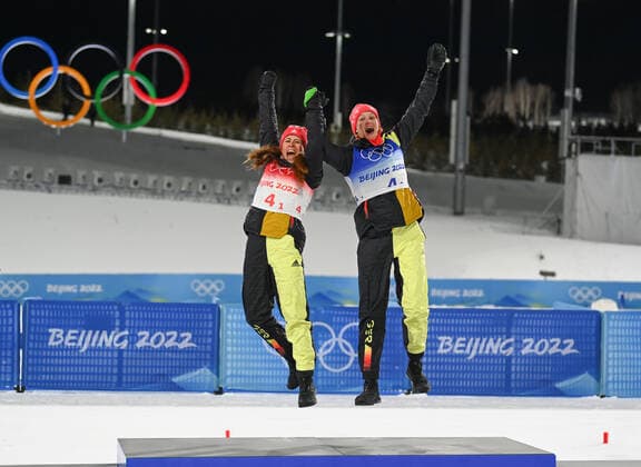 (220216) -- ZHANGJIAKOU, Feb. 16, 2022 -- Gold medalists Katharina Hennig (L) and Victoria Carl of Germany celebrate on the podium during the flower ceremony for the cross-country skiing women s team sprint classic final of Beijing 2022 Winter Olympics at National Cross-Country Skiing Centre in Zhangjiakou, north China s Hebei Province, Feb. 16, 2022. ) (BEIJING2022)CHINA-ZHANGJIAKOU-OLYMPIC Winter games, Winterspiele,Spiele, Summer games CROSS-COUNTRY SKIING-WOMEN S TEAM SPRINT CLASSIC- FINAL (CN) DengxHua 