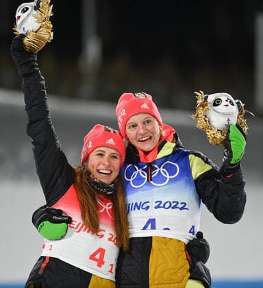 (220216) -- ZHANGJIAKOU, Feb. 16, 2022 -- Gold medalists Katharina Hennig (L) and Victoria Carl of Germany celebrate on the podium during the flower ceremony for the cross-country skiing women s team sprint classic final of Beijing 2022 Winter Olympics at National Cross-Country Skiing Centre in Zhangjiakou, north China s Hebei Province, Feb. 16, 2022. ) (BEIJING2022)CHINA-ZHANGJIAKOU-OLYMPIC Winter games, Winterspiele,Spiele, Summer games CROSS-COUNTRY SKIING-WOMEN S TEAM SPRINT CLASSIC- FINAL (CN) DengxHua 