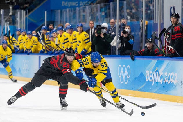 220216 Tyler Wotherspoon of Canada and Linus Johansson of Sweden in the men?s Ice hockey, Eishockey quarterfinal between Sweden and Canada during day 12 of the 2022 Winter Olympics on February 16, 2022 in Beijing. Photo: Maxim Thore BILDBYRAN kod MT MT0326 ishockey ice hockey Olympic Games, Olympische Spiele, Olympia, OS olympics winter olympics os ol olympiska spel vinter-os olympiske leker peking peking 2022 beijing 2022 beijing 2022 olympic games beijing 2022 winter olympic games peking-os beijing-ol vinter-ol 12 bbeng kvartsfinal sverige kanada Copyright: MAXIMxTHORE BB220216MT107