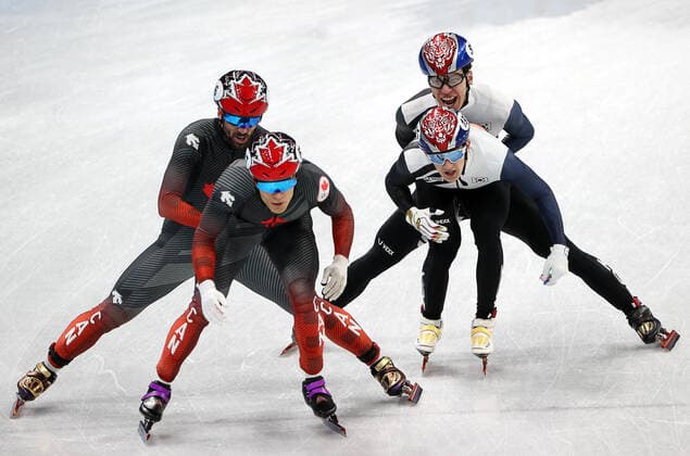 BEIJING, CHINA - FEBRUARY 16, 2022: Steven Dubois, Jordan Pierre-Gilles of Canada and Hwang Dae-heon, Kwak Yoon-gy (L-R) of South Korea compete in a men s 5000m short track Speed skating, Eisschnelllauf relay final at the 2022 Winter Olympic Games, Olympische Spiele, Olympia, OS at the Capital Indoor Stadium. Valery Sharifulin TASS  TS1239F7