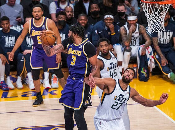 February 16, 2022, Los Angeles, California, USA: Anthony Davis 3 of the Los Angeles Lakers wins an offensive round from Rudy Gobert 27 of the Utah Jazz during their NBA, Basketball Herren, USA home game on Wednesday February 16, 2022 at Crypto.com Arena in Los Angeles, California. Davis injures his ankle as he comes down with the ball. PI Los Angeles USA - ZUMAp124 20220216_zaa_p124_022 Copyright: xJAVIERxROJASx