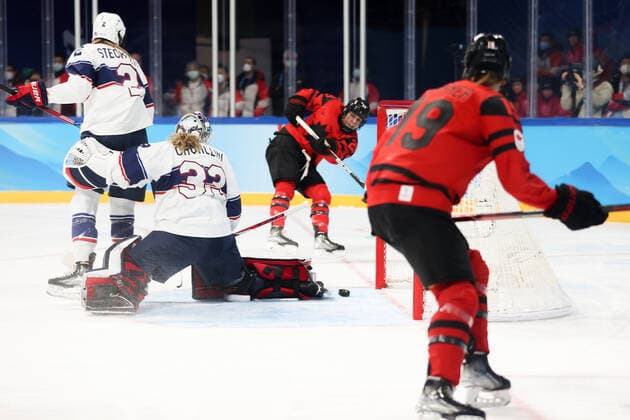 BEIJING, CHINA - FEBRUARY 17, 2022: Goaltender Alex Cavallini of the US, supported by Lee Stecklein (R-L middle), concedes a goal scored by Marie-Philip Poulin (back) of Canada in their Ice hockey, Eishockey gold medal match at the Wukesong Arena as part of the 2022 Winter Olympic Games, Olympische Spiele, Olympia, OS Sergei Bobylev TASS  TS123B57