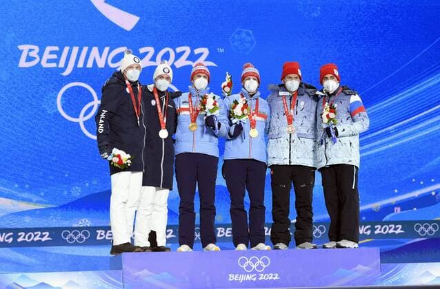 From left, silver medalists Iivo Niskanen and Joni Mäki of Finland, gold medalists Erik Valnes and Johannes Hoesflot Kläbo of Norway and bronze medalists Alexander Bolshunov and Alexander Terentev of ROC pose on the podium during the victory ceremony of Men s Cross Country Skiing Team Sprint Classic at the Beijing Winter Olympic Games, Olympische Spiele, Olympia, OS in Zhangjiakou on February 17, 2022. Zhangjiakou China LKFTJ20220217144945QFLT  Copyright: xMarkkuxUlanderx