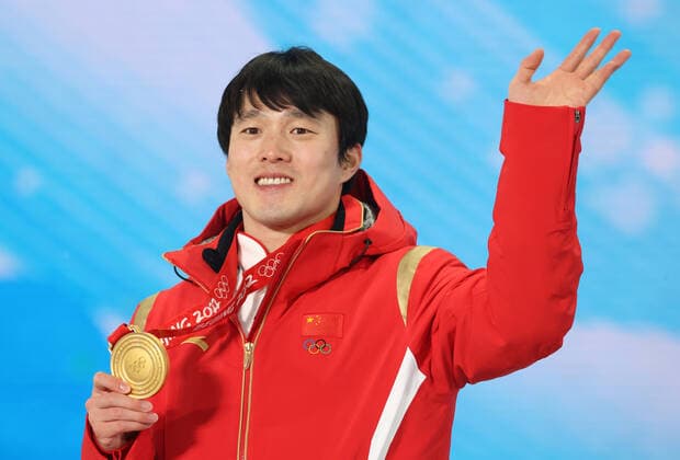 ZHANGJIAKOU, CHINA - FEBRUARY 17, 2022: Gold medal winner Qi Guangpu of China waves during the victory ceremony for the men s freestyle skiing aerials, at the Medal Plaza, at the 2022 Winter Olympic Games, Olympische Spiele, Olympia, OS Stanislav Krasilnikov TASS  TS123D43