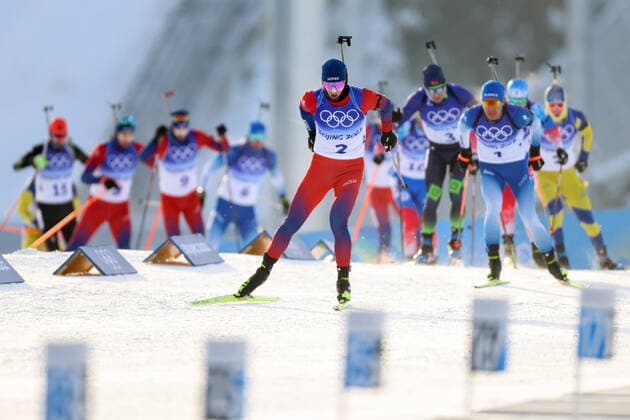 ZHANGJIAKOU, CHINA - FEBRUARY 18, 2022: Johannes Thingnes Boe (front) of Norway competes in the men s 15km biathlon mass start race during the Beijing 2022 Winter Olympic Games, Olympische Spiele, Olympia, OS at the National Biathlon Centre. Stanislav Krasilnikov TASS  TS124060