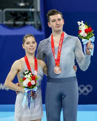 BEIJING, CHINA - FEBRUARY 19, 2022: Bronze medalists Anastasia Mishina and Alexander Gallyamov of Team ROC at a flower ceremony for the pair skating at the 2022 Winter Olympic Games, Olympische Spiele, Olympia, OS at the Capital Indoor Stadium. Valery Sharifulin TASS  TS12456D