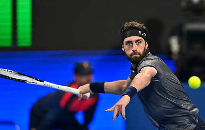 (220220) -- DOHA, Feb. 20, 2022 -- Nikoloz Basilashvili of Georgia returns the ball during the ATP, Tennis Herren Qatar Open tennis tournament final at the Khalifa International Tennis Complex in Doha, Feb.19, 2022. (Photo by Xinhua) (SP)QATAR-DOHA-TENNIS-ATP QATAR OPEN Nikku 