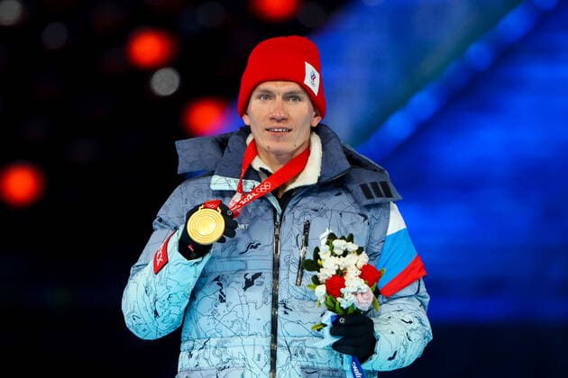 BEIJING, CHINA â€“ FEBRUARY 20, 2022: Gold medallist Alexander Bolshunov of Team ROC poses at a victory ceremony for the men s 30km cross-country skiing mass start race at the closing ceremony of the Beijing 2022 Winter Olympic Games, Olympische Spiele, Olympia, OS at the National Stadium (also known as the Bird s Nest). The men s 50km cross-country skiing mass start race has been shortened to 30km due to weather conditions. Valery Sharifulin TASS  TS124955