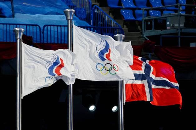 BEIJING, CHINA â€“ FEBRUARY 20, 2022: ROC flag and a Norwegian national flag fly at a victory ceremony for the men s 30km cross-country skiing mass start race at the closing ceremony of the Beijing 2022 Winter Olympic Games, Olympische Spiele, Olympia, OS at the National Stadium (also known as the Bird s Nest). The men s 50km cross-country skiing mass start race has been shortened to 30km due to weather conditions. Valery Sharifulin TASS  TS12497E