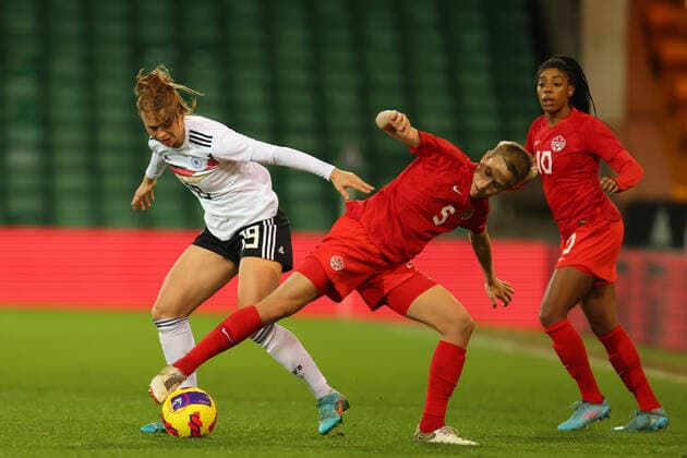 20th February 2022 ; Carrow Road, Norwich, Norforlk, England; Arnold Clark Womens International football Canada versus Germany: Quinn of Canada challenges Klara Buhl of Germany  ActionPlus12366195 ShaunxBrooks