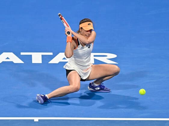 (220221) -- DOHA, Feb. 21, 2022 -- Aliz Cornet of France returns the ball during the first round of WTA, Tennis Damen Qatar Open tennis tournament match against Liudmila Samsonova of Russia at the Khalifa International Tennis Complex in Doha, capital of Qatar, on Feb. 20, 2022. (Photo by Nikku Xinhua) (SP)QATAR-DOHA-TENNIS-WTA QATAR OPEN yangyuanyong 