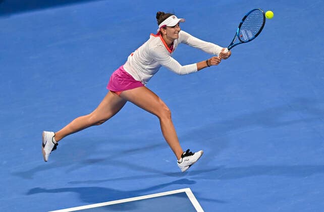 (220222) -- DOHA, Feb. 22, 2022 -- Irina-Camelia Begu of Romania returns the ball during the first round of WTA, Tennis Damen Qatar Open tennis tournament match against Petra Kvitova of the Czech Republic at the Khalifa International Tennis Complex in Doha, capital of Qatar, on Feb. 21, 2022. (Photo by Xinhua) (SP)QATAR-DOHA-TENNIS-WTA QATAR OPEN Nikku 
