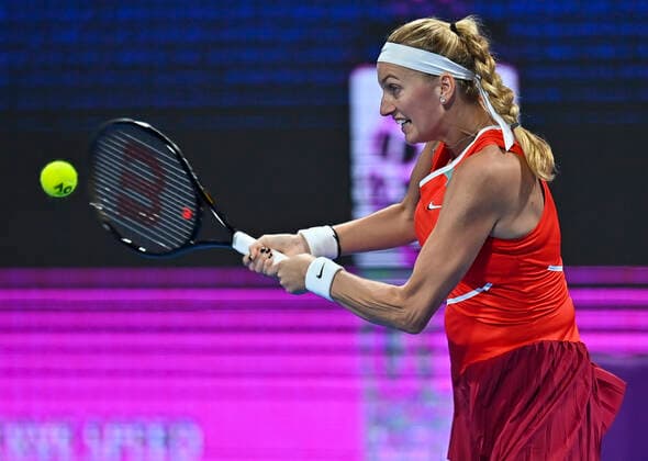 (220222) -- DOHA, Feb. 22, 2022 -- Petra Kvitova of the Czech Republic returns the ball during the first round of WTA, Tennis Damen Qatar Open tennis tournament match against Irina-Camelia Begu of Romania at the Khalifa International Tennis Complex in Doha, capital of Qatar, on Feb. 21, 2022. (Photo by Nikku Xinhua) (SP)QATAR-DOHA-TENNIS-WTA QATAR OPEN yangyuanyong 